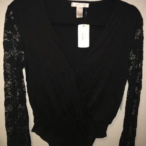 Brand new beautiful lace long sleeve body suit